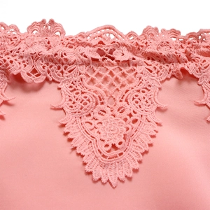 Close-up of pink dress neckline featuring intricate hollow-out floral lace embroidery