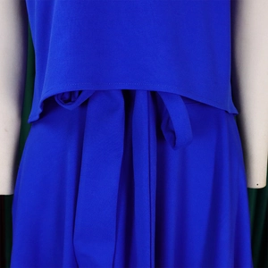 Detail of royal blue fabric with fine texture and adjustable waist tie on elegant outfit