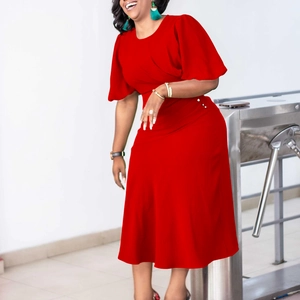 Detail of red midi dress showing elegant ruffle sleeves and premium woven fabric texture