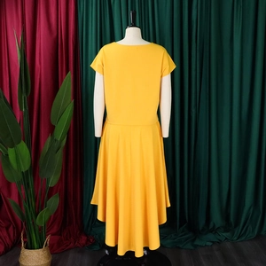 Back view of a yellow plus-size two-piece set with short sleeve top and high-low skirt