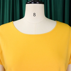 Detail of round neck ginger short sleeve top showing breathable fabric on mannequin