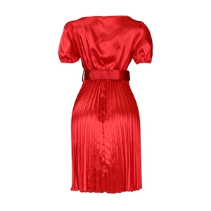 Detail of red satin short sleeve dress with pleated skirt and waist belt