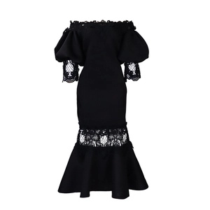 Detail of off-the-shoulder black dress with puff sleeves and lace hem mermaid skirt