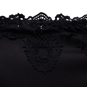 Close-up of black floral lace embroidery and hollowed-out edges on a party dress