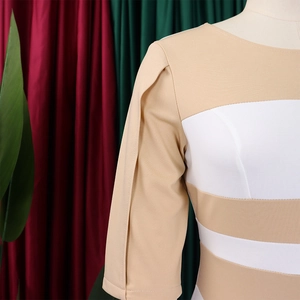 Detail of round neck beige and white colorblock dress with unique pleated sleeves