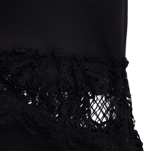 Detail of elegant black lace embroidery and premium fabric texture on the dress