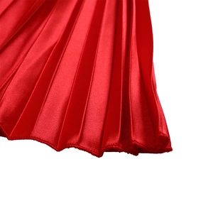 Detail of red pleated satin fabric with smooth texture for women summer dress