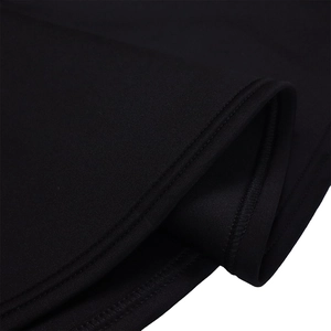 Detailed close-up of double-needle stitching on the hem of a black mermaid evening dress