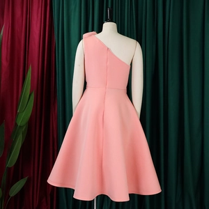 Detail of pink one-shoulder formal dress showing back zipper and structured A-line skirt