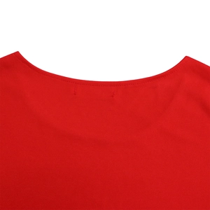 Macro detail of the round neckline and stitching on this solid red knitted plus size top