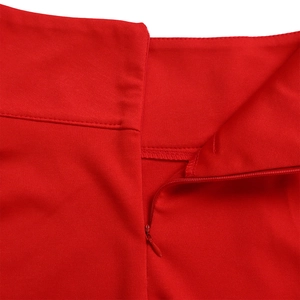 Detail of red plus size skirt set showing invisible zipper and fine diagonal fabric texture