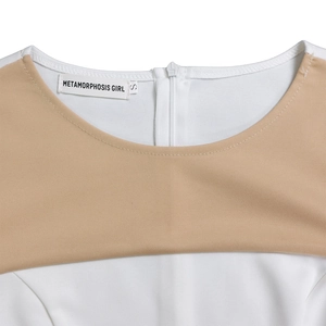 Detailed neckline view of a contrast panel dress featuring an invisible back zipper and tag