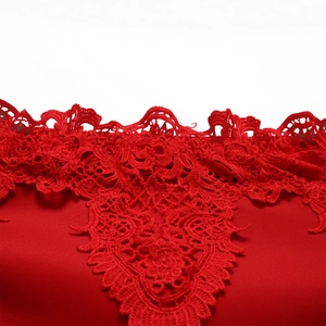 Detail showing intricate red lace stitching and hollow design on an evening gown neckline