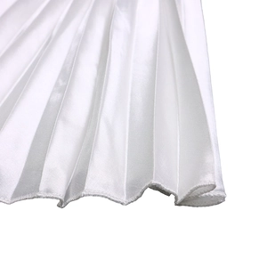 Detail of white pleated satin fabric showing vertical texture and hemmed edge stitching