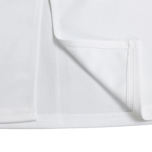 Close-up of white dress hem featuring precise double-needle stitching and fabric texture