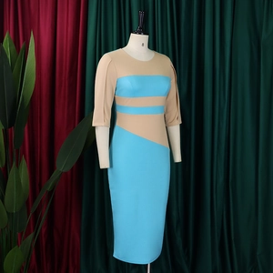 Detail of color-block pencil dress in sky blue and khaki with a slim-fit silhouette
