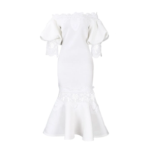Close-up of white off-shoulder lace neckline and puff sleeves on fishtail dress