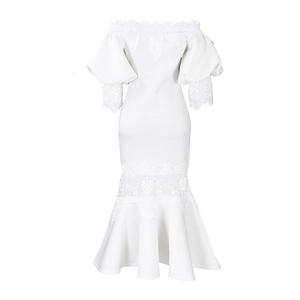 Close-up of elegant off-shoulder white lace dress with bubble sleeves and crochet trim