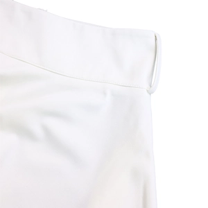 Close-up of the waistband stitching and belt loop on white plus size skirt set