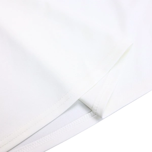 Detail shot of high-quality double-needle stitching on white fabric hem and sleeve