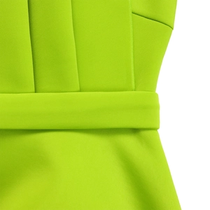Detailed view of high-waist pleats and matching belt on this neon green evening dress