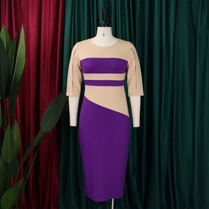 Detail of color-block dress with purple and beige panels and pleated sleeve cuffs