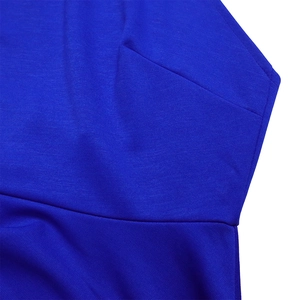 Detailed macro view of royal blue knit fabric showing fine texture and sewing seams