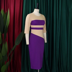 Detail view of purple and beige color block bodycon midi dress with short sleeves