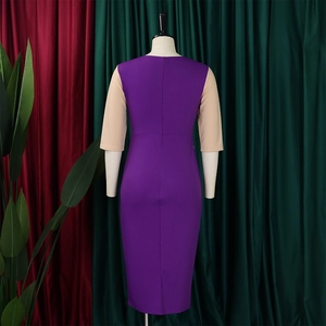 Detail view of the color-block dress back with invisible zipper and pencil skirt hemline