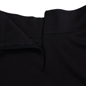 Close-up of the invisible zipper closure on the black elegant skirt waistline detail