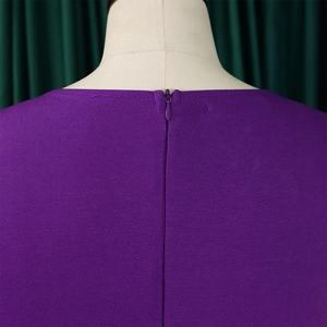 Detail of purple knit dress showing high-quality invisible back zipper and fine texture