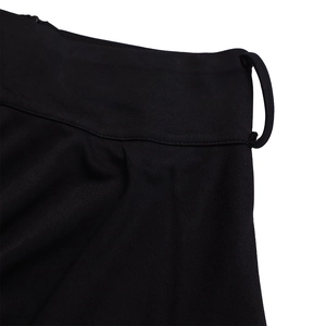 Close-up of wide waistband and belt loop detail on black maxi skirt and top set