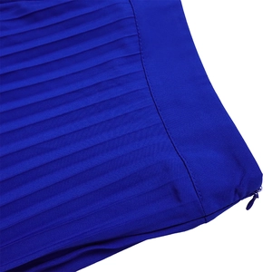Macro detail of royal blue pleated fabric featuring a neat side invisible zipper closure
