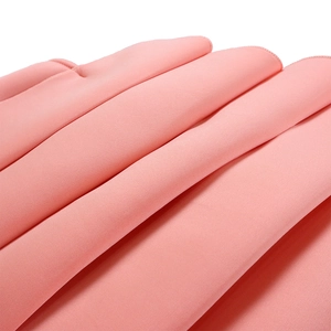 Macro detail of soft pink pleated chiffon fabric with high-density twill weave and fine stitching