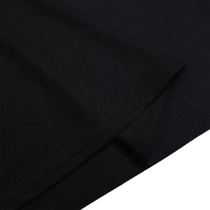 Close-up of high-quality double-needle stitching on black knit fabric hem and cuffs