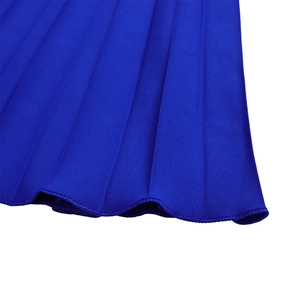 Detail shot of royal blue pleated fabric hem with precise stitching and sharp pleats