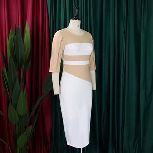 Detail view of a slim fit color-block dress with puff sleeves on a display mannequin