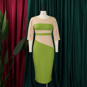 Detail of color-block bodycon midi dress featuring contrast beige and lime green panels