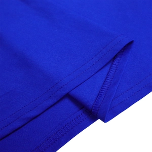 Detailed view of the double-needle stitched hem and overlock seam on blue fabric