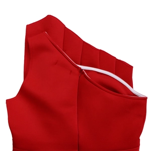 Detail of red off-shoulder evening dress with pleated neckline and invisible back zipper