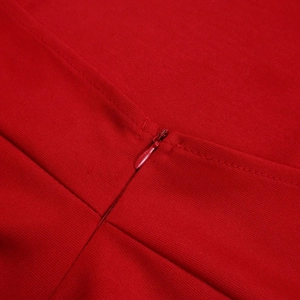 Close-up of a seamless red invisible zipper and woven texture on a fashion set