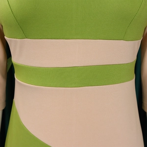 Detail of color-block dress showing green and pink ribbed knit fabric stitching