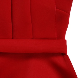 Detail of red dress waist featuring vertical pleated texture and fine stitching