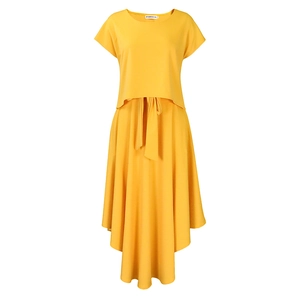 Detail of a bright yellow two-piece set featuring a high-waisted skirt and tie-waist belt