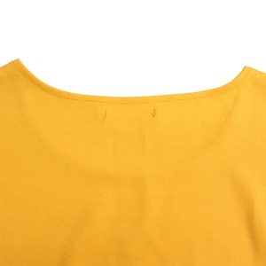 Detail of round neckline with fine stitching on bright yellow plus size top fabric