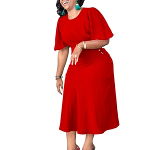 Detail of red slim dress featuring round neck, puff sleeves and pearl waist buttons