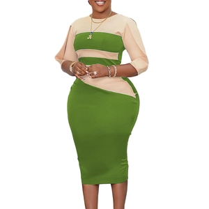 Detail of color-block dress featuring lime green and beige patchwork with a slim fit cut