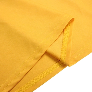 Detail view of double-needle stitching on bright yellow plus size garment hem