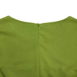 Detail view of the green plus size dress showing the back neckline and hidden zipper