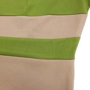 Close-up of green and beige striped knit fabric with detailed side stitching